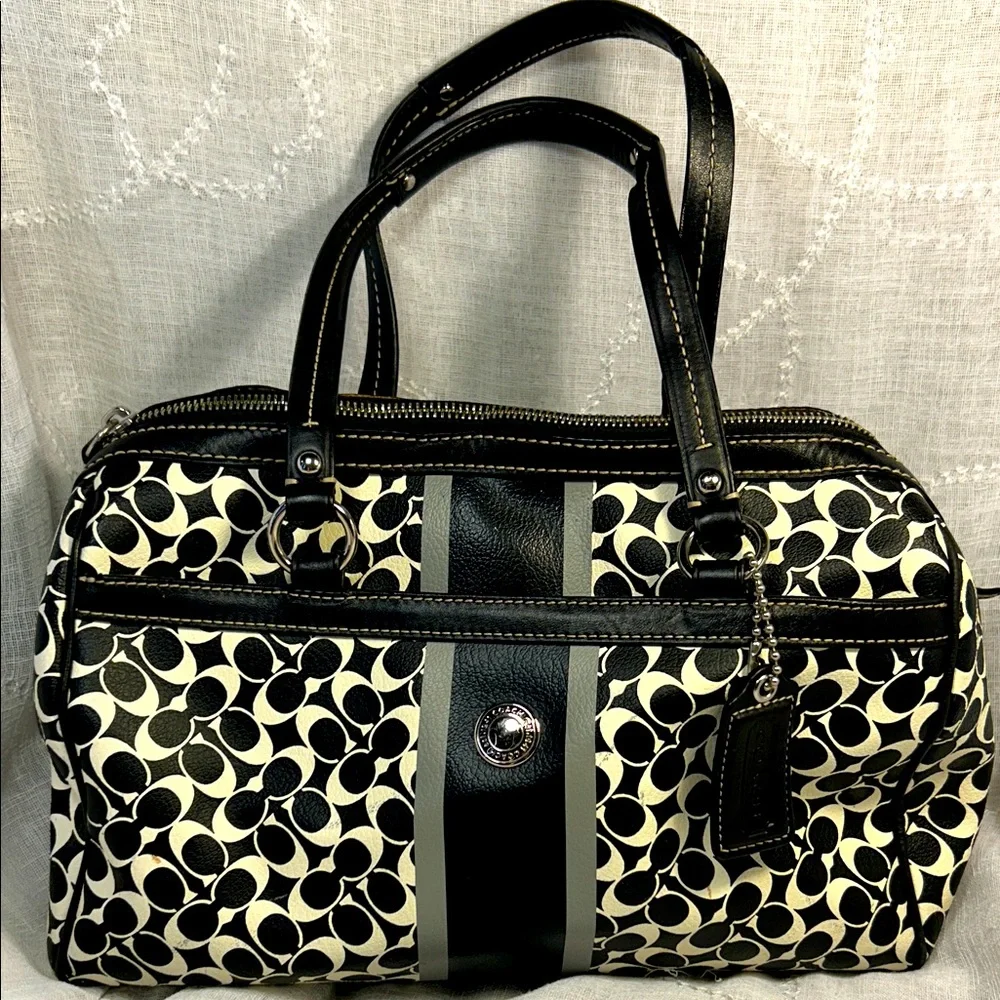 Coach boston leather travel bag with a tag